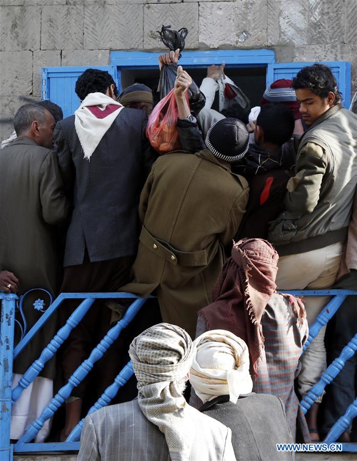 YEMEN-SANAA-FAMINE-BREAD DISTRIBUTION