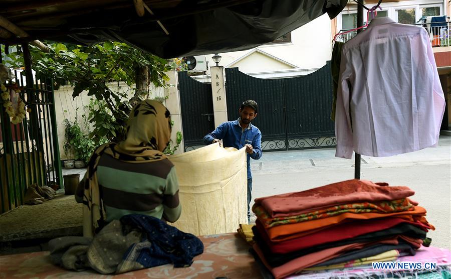 INDIA-NEW DELHI-CLOTHES-IRONING STAND