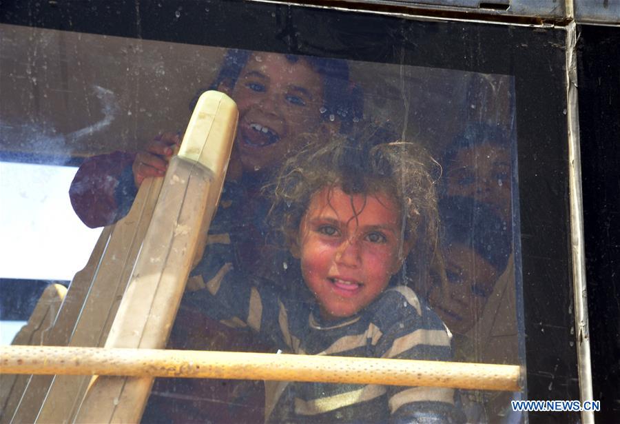 SYRIA-HOMS-REFUGEES-RETURN