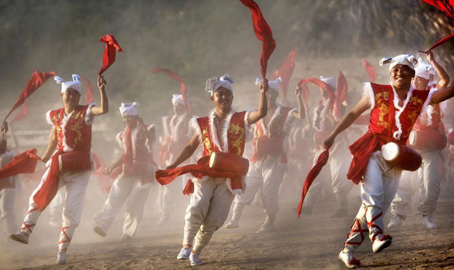 Villagers perform Ansai waist drums in Yan'an, NW China's Shaanxi