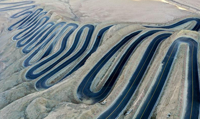 Aerial view of "plateau sky road" in NW China's Xinjiang