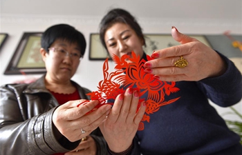 In pics: paper-cutting inheritor in NW China's Gansu