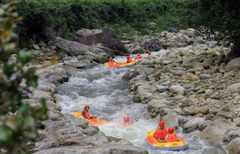 Tourists experience drifting at Shunhuangshan National Forest Park in Hunan